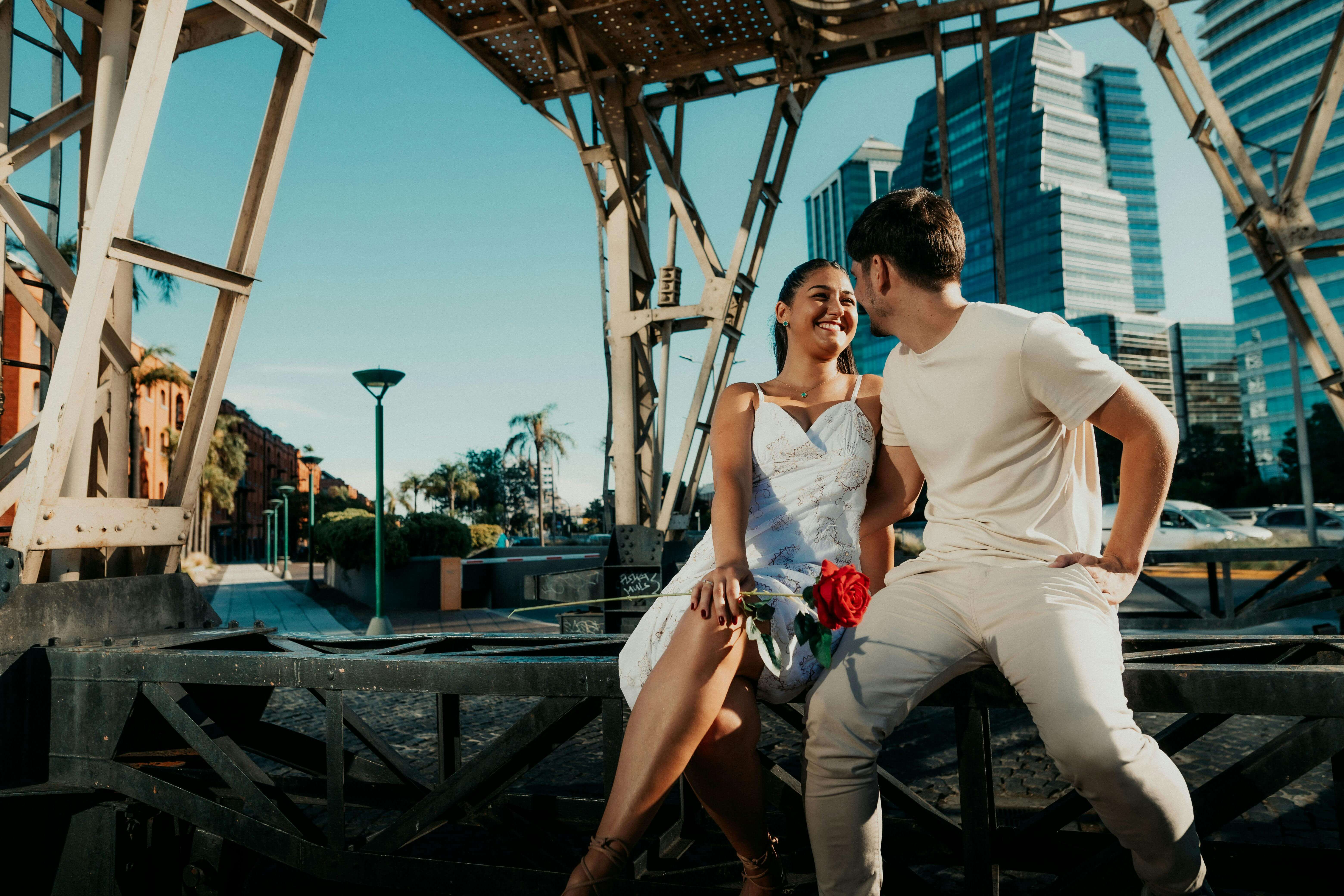 Happy couple sharing a moment outdoors in Buenos Aires. Bright, cheerful scene.