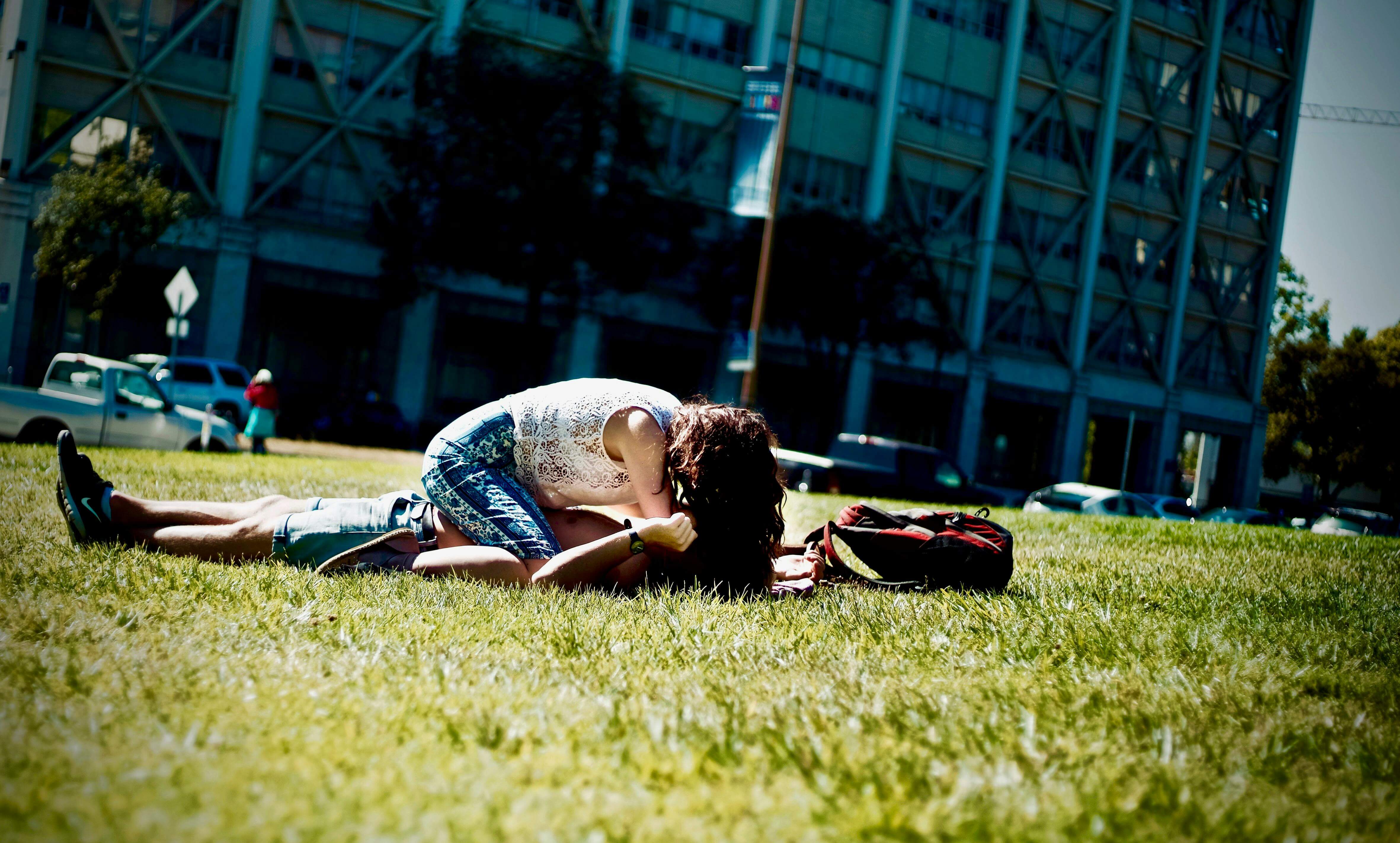 A young couple enjoying a sunny day on a grassy lawn in Berkeley, California.